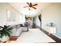 Spacious living room with hardwood floors and a view of the kitchen at 18992 Roseate Dr, Lutz, FL 33558