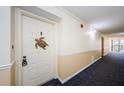 Condo hallway with carpeted floor and neutral walls at 2700 Bayshore Blvd # 11302, Dunedin, FL 34698