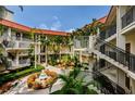 Condo community courtyard with fountain and landscaping at 2700 Bayshore Blvd # 4309, Dunedin, FL 34698