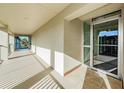 Lighted condo hallway with access to upper floor at 2700 Bayshore Blvd # 4309, Dunedin, FL 34698