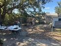 Spacious backyard featuring concrete patio and partial chain link fence at 3416 N 48Th St, Tampa, FL 33605