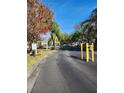 Gated community entrance with palm trees and landscaping at 3653 Kings Rd # 101, Palm Harbor, FL 34685