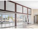 Bright living room with sliding doors to a sunroom and water views at 713 Gran Kaymen Way, Apollo Beach, FL 33572