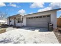 Updated home exterior with a large driveway at 9608 Richwood Ln, Port Richey, FL 34668