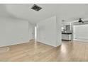 Spacious living room with light wood flooring at 9608 Richwood Ln, Port Richey, FL 34668
