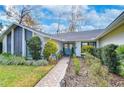 Inviting front entry with walkway and landscaping at 105 Locust Dr, Brandon, FL 33511