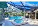 Relaxing screened pool and spa with patio furniture at 105 Locust Dr, Brandon, FL 33511