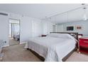 Large main bedroom with king-size bed and mirrored closet doors at 17940 Gulf Blvd # 15C, Redington Shores, FL 33708