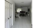 Bright entryway with tile floors leading to living room at 18827 Tournament Trl, Tampa, FL 33647