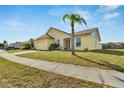 Single-story home with a two-car garage and a palm tree at 201 Lookout Dr, Apollo Beach, FL 33572