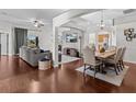 Open concept living and dining area with hardwood floors at 2309 Cross Tee Ct, Brooksville, FL 34604