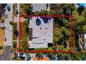 Aerial view of the home's dimensions of 83ft x 128ft outlined in red at 3110 W De Bazan Ave, St Pete Beach, FL 33706