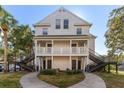 Two-story building exterior with stairs, balconies, and landscaping, offering curb appeal at 3300 Haviland Ct # 303, Palm Harbor, FL 34684