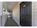 Hallway with access to a condo unit, showing the entrance and building's interior at 3300 Haviland Ct # 303, Palm Harbor, FL 34684