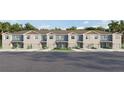 Beige townhome community with 2-car garages and neutral-color exteriors at 4449 Rachel Falls Dr, Tampa, FL 33610