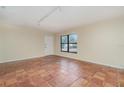 Bright living room with tile floors and a door to the outside at 4651 Summerwind Dr # 26, Sarasota, FL 34234