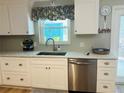 Newly remodeled kitchen with white cabinets and stainless steel appliances at 5067 Maplewood Dr, Hernando Beach, FL 34607