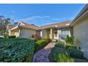 Brick walkway to the front door, nicely landscaped at 2405 New Haven Cir, Sun City Center, FL 33573