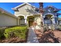 Two story house with lush landscaping and a welcoming entrance at 5107 Lady Rose Ct, Lutz, FL 33558