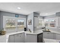 Bright kitchen with white cabinets and granite counters at 6191 Bahia Del Mar Blvd # 201, St Petersburg, FL 33715