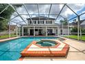 Relaxing screened-in pool and spa area at 12908 Cinnimon Pl, Tampa, FL 33624