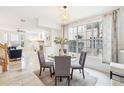 Dining area with glass table and four chairs, near the kitchen at 2794 Countryside Blvd # 1, Clearwater, FL 33761