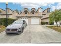 Two-story townhome with attached double garage and driveway at 2794 Countryside Blvd # 1, Clearwater, FL 33761