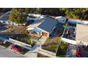 Single-story house with a detached shed and a fenced yard at 4427 Gandy Cir, Tampa, FL 33616