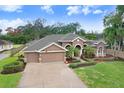 Stunning property with a large backyard and spacious driveway at 512 Creekside Ct, Safety Harbor, FL 34695