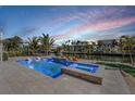Luxury pool and spa overlooking a canal at 519 Loquat Dr, Anna Maria, FL 34216