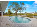 Relaxing pool area with patio and lake view at 5713 39Th Street E Cir, Bradenton, FL 34203