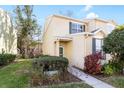 Two-story townhome with well-maintained landscaping at 6333 Osprey Lake Cir, Riverview, FL 33578