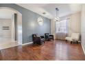 Bright dining room with hardwood floors and stylish light fixture at 13029 Haverhill Dr, Spring Hill, FL 34609