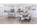 Modern kitchen with granite countertops and an island with seating at 4061 Westwood Fields Loop, Plant City, FL 33565