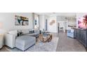 Open concept living room featuring a sectional sofa and large TV at 4061 Westwood Fields Loop, Plant City, FL 33565