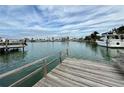 Private wooden dock offering waterfront access and views at 6437 1St Palm Pt, St Pete Beach, FL 33706