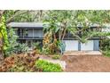 Elevated view of a home nestled in a tree-lined neighborhood at 751 Pinellas Point S Dr, St Petersburg, FL 33705