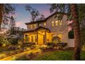 Two-story house with a walkway, landscaping, and a charming facade at 811 19Th N Ave, St Petersburg, FL 33704