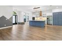 Modern kitchen with a large island and stainless steel appliances at 9116 Exposition Dr, Tampa, FL 33626
