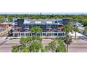 Aerial view of a modern building with street-level retail and residential units above at 13 29Th N St, St Petersburg, FL 33713