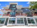 Modern building's exterior showcasing street-level commercial space and upper residential units at 13 29Th N St, St Petersburg, FL 33713