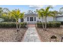 Charming home exterior with walkway and lush landscaping at 136 26Th Ne Ave, St Petersburg, FL 33704