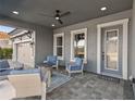 Relaxing front porch with seating area and fire pit at 14215 Swiss Bridge Dr, Riverview, FL 33579