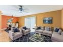Bright living room with dining area, featuring comfortable seating and tile floors at 1960 Union St # 42, Clearwater, FL 33763