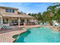 Outdoor pool with an outdoor bar and lounge area, great for relaxing and entertaining guests at 2902 Big Cypress Way, Wesley Chapel, FL 33544