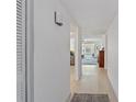 Bright entryway with view to living room and hardwood floors at 4520 Overlook Ne Dr # 238, St Petersburg, FL 33703
