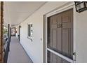 Building hallway with doors to individual condo units at 4520 Overlook Ne Dr # 238, St Petersburg, FL 33703