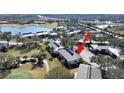 Aerial view showcasing the condo building's location near a golf course at 4946 Mill Pond Rd # 3180, Wesley Chapel, FL 33543
