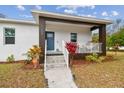 Modern home exterior featuring a covered porch and walkway at 524 S Grosse Ave, Tarpon Springs, FL 34689