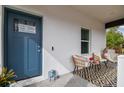 Stylish blue front door with glass accents and welcoming entryway at 524 S Grosse Ave, Tarpon Springs, FL 34689